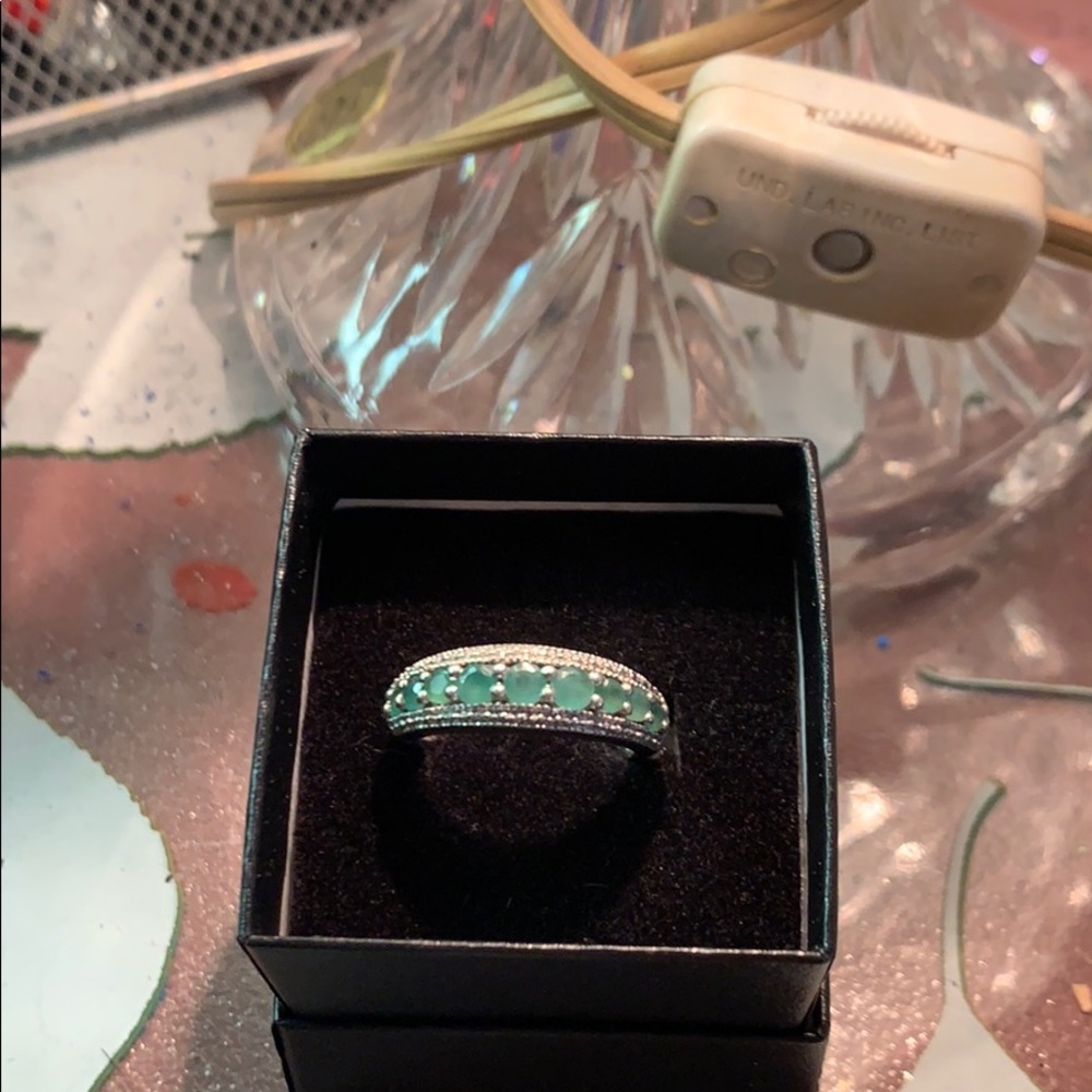 9 Emeralds and Diamond ring